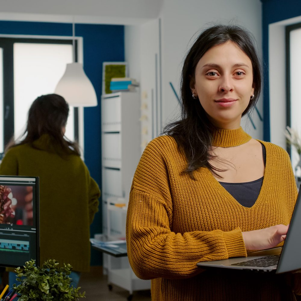 woman-retoucher-looking-camera-smiling-working-creative-media-agency-standing-front-webc (1) woman-retoucher-looking-camera-smiling-working-creative-media-agency-standing-front-webc (1)